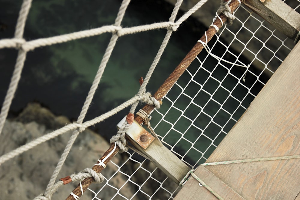 white rope tied on brown wooden post