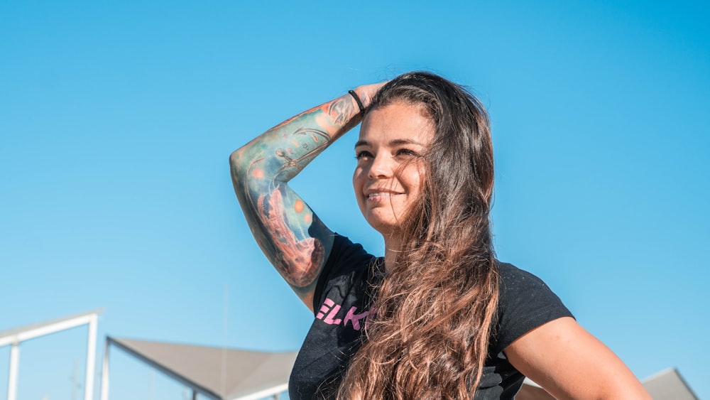 a woman with a tattoo on her arm