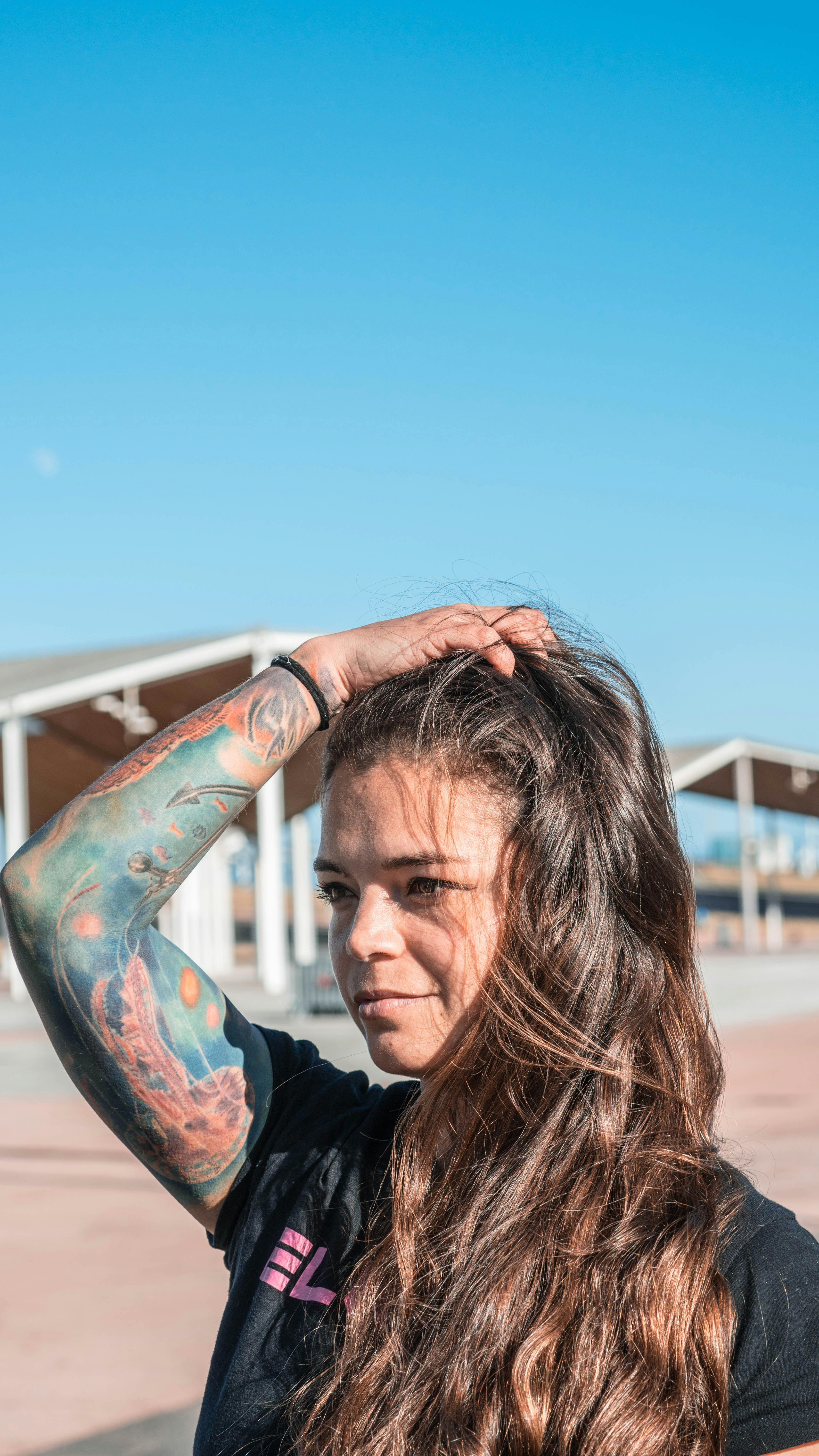 woman in black shirt with blue and red paint on her face