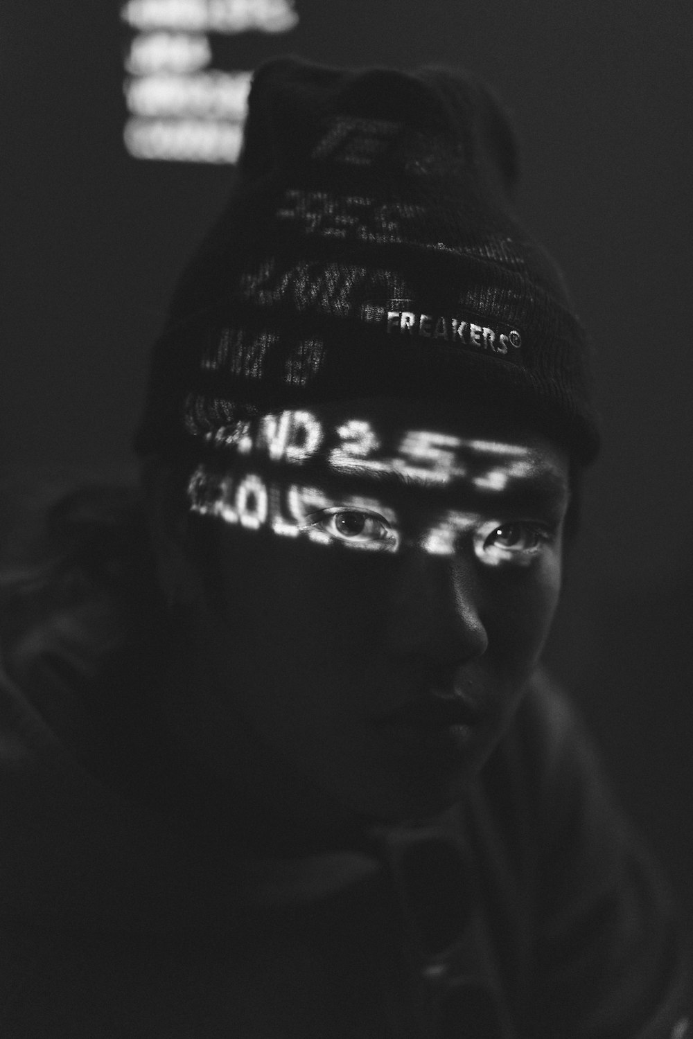 man wearing black knit cap