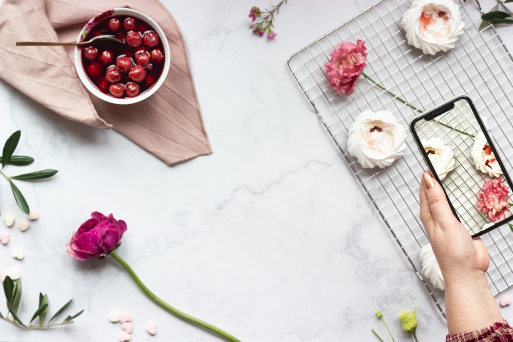 white and pink roses on white ceramic plate