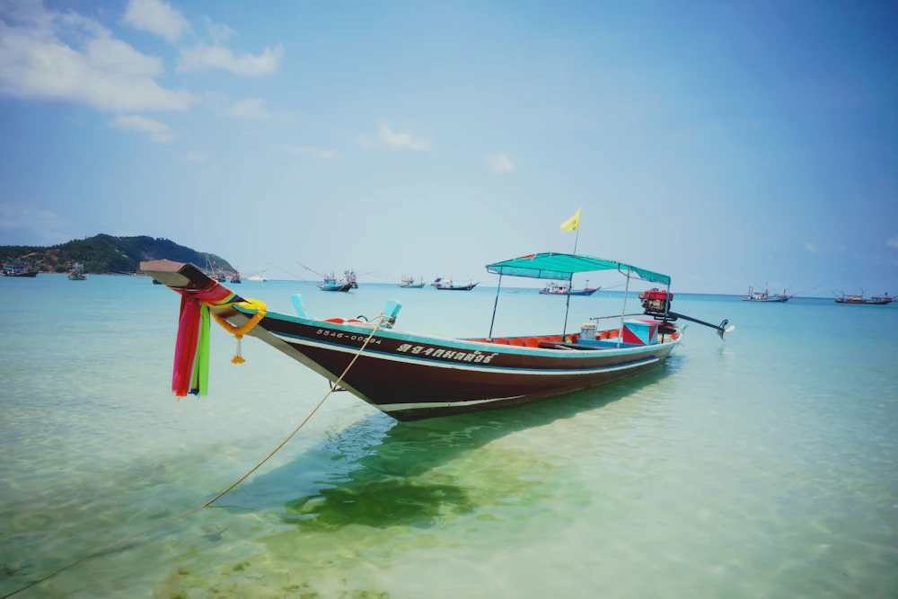 A wooden boat on the water off Koh Phangan