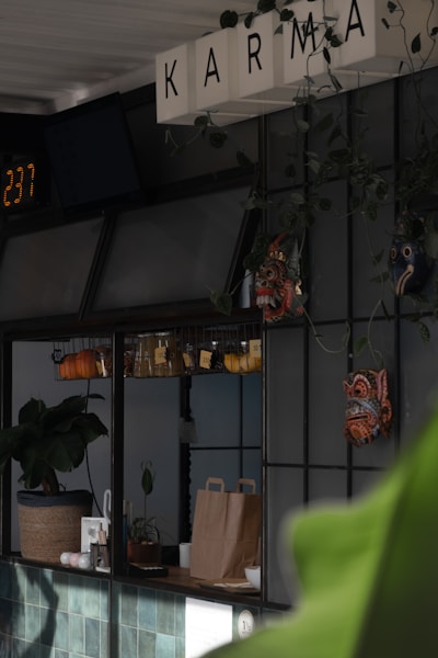 black and green wall mounted digital clock at 12 00