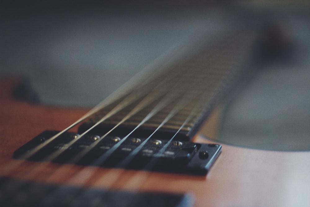 brown and black acoustic guitar