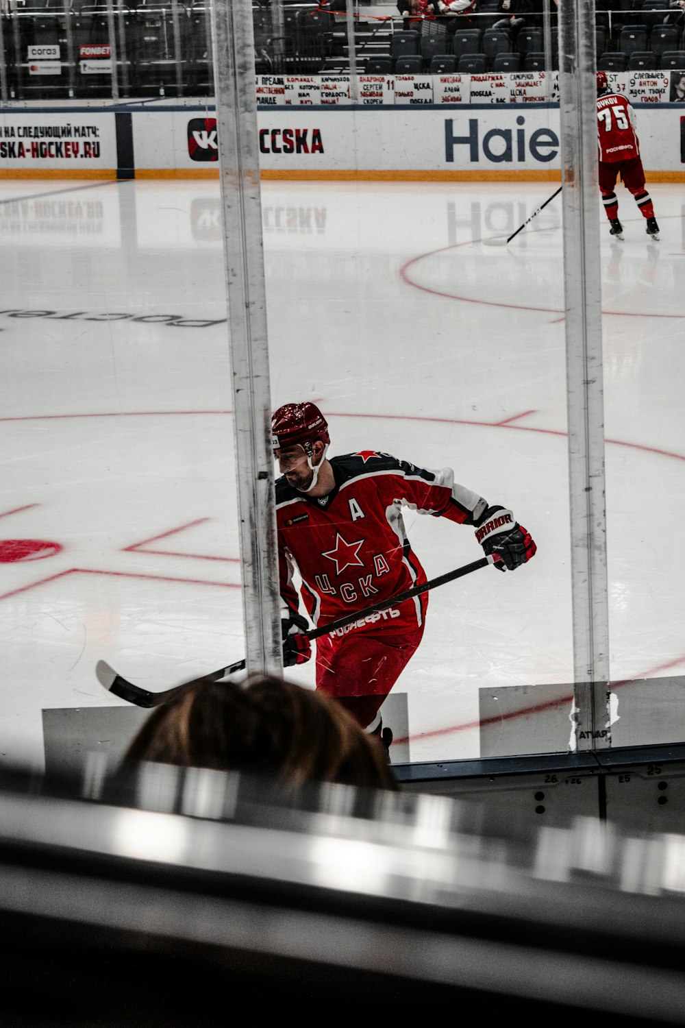 2 men playing ice hockey