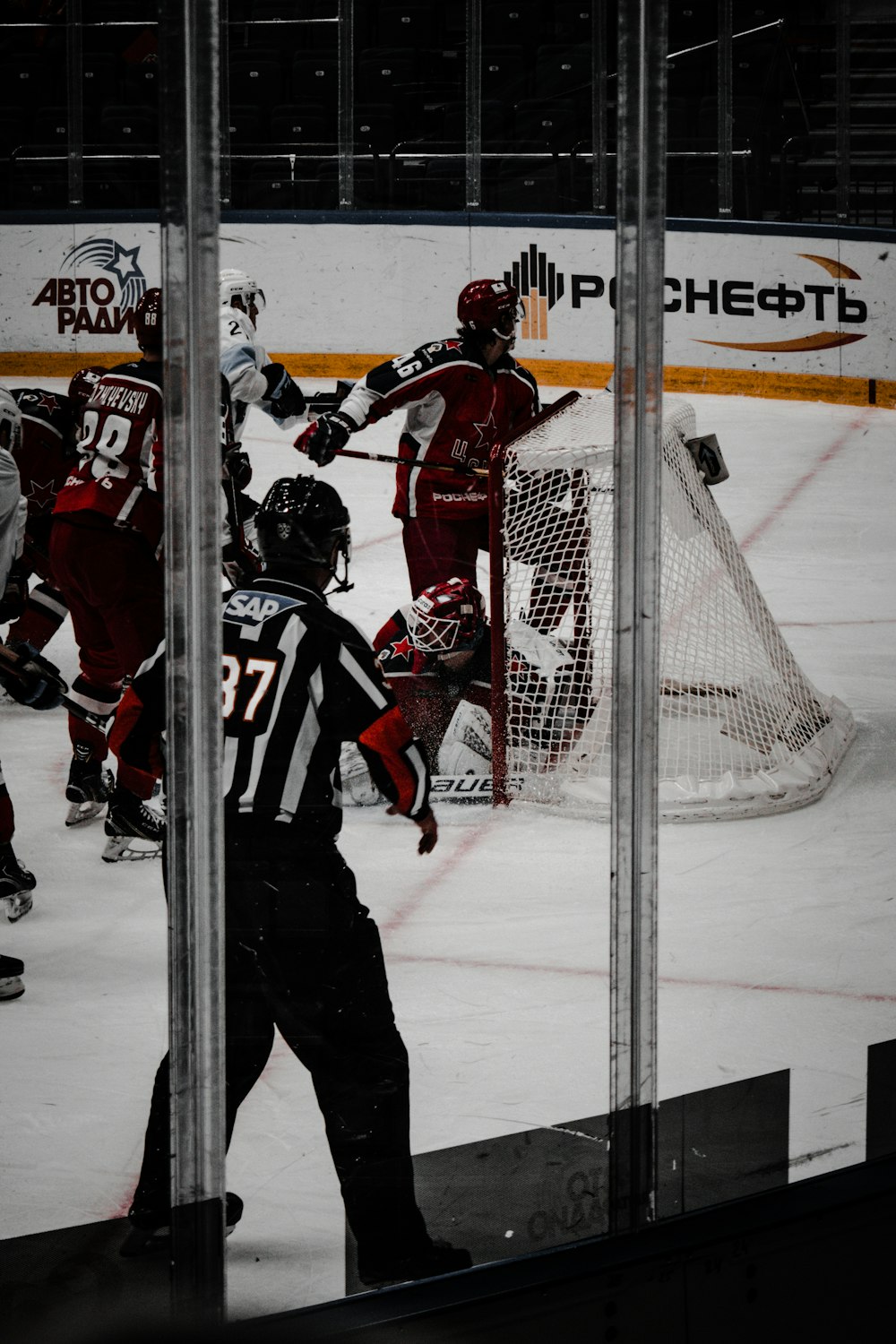 2 men in red and white ice hockey jersey