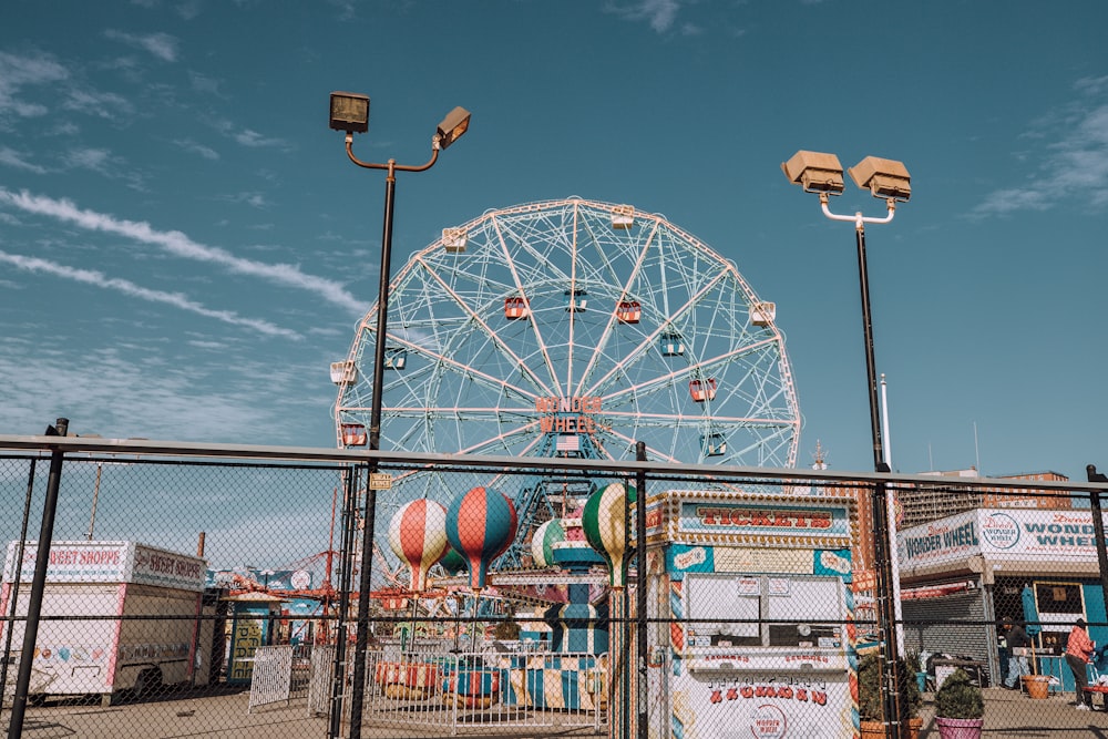 white ferris wheel under blue sky during daytime