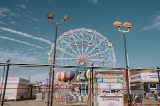 white ferris wheel under blue sky during daytime