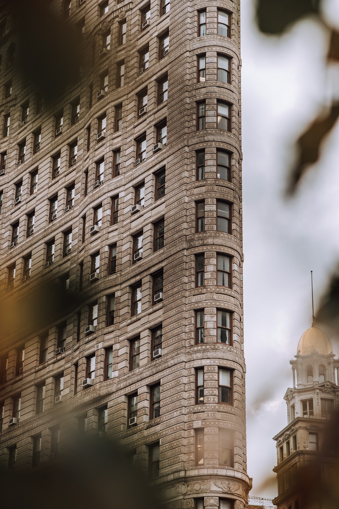 brown concrete building under cloudy sky during daytime