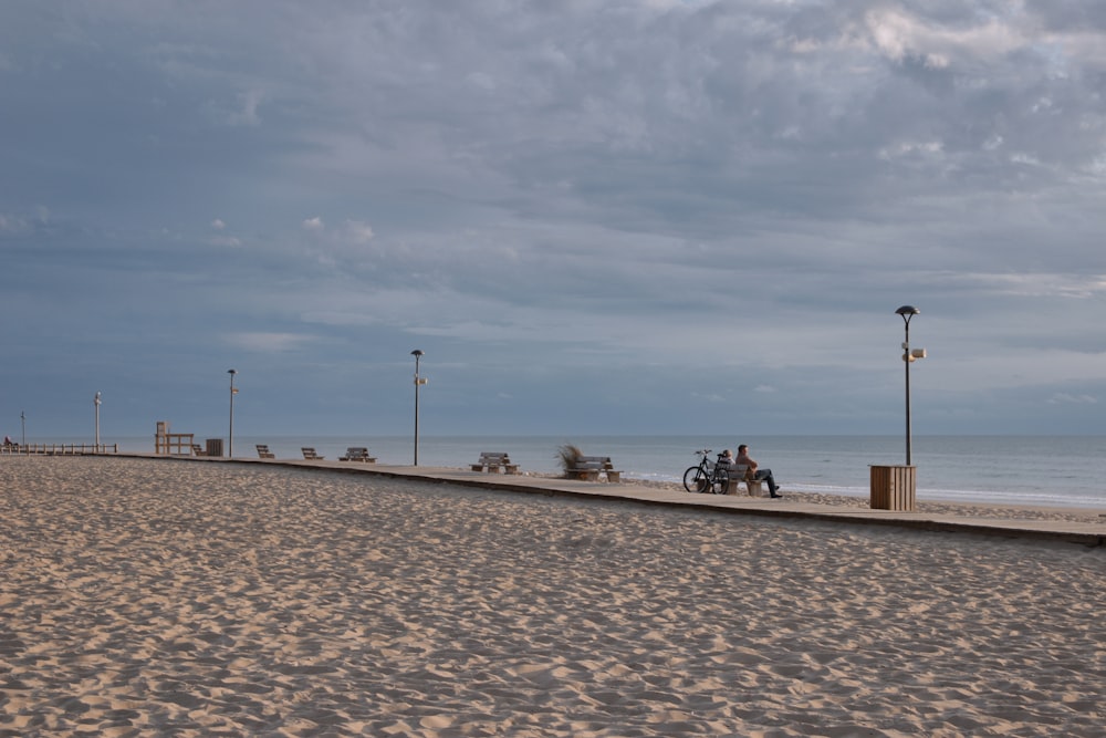 people sitting on beach shore during daytime