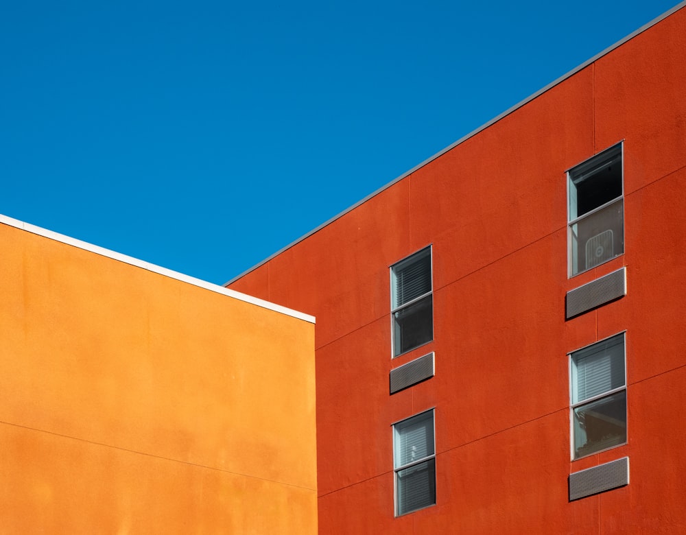 Corner of building. Modern architecture. Green and orange color in exterior  of building. 12612383 Stock Photo at Vecteezy