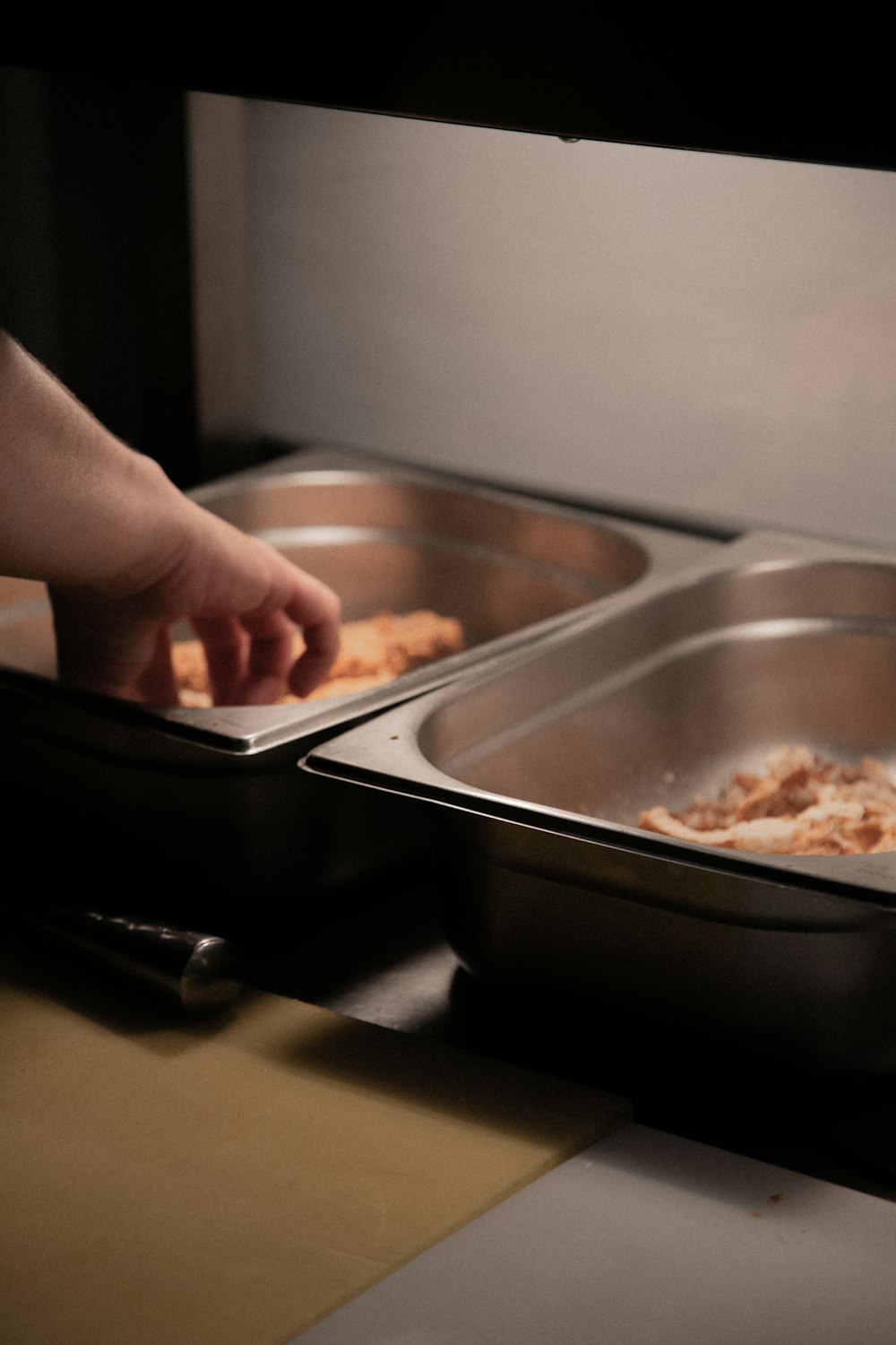 person holding stainless steel tray