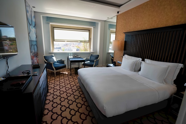 Professional cleaning and check-in service in a modern hotel room.