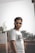man in white crew neck t-shirt wearing black sunglasses