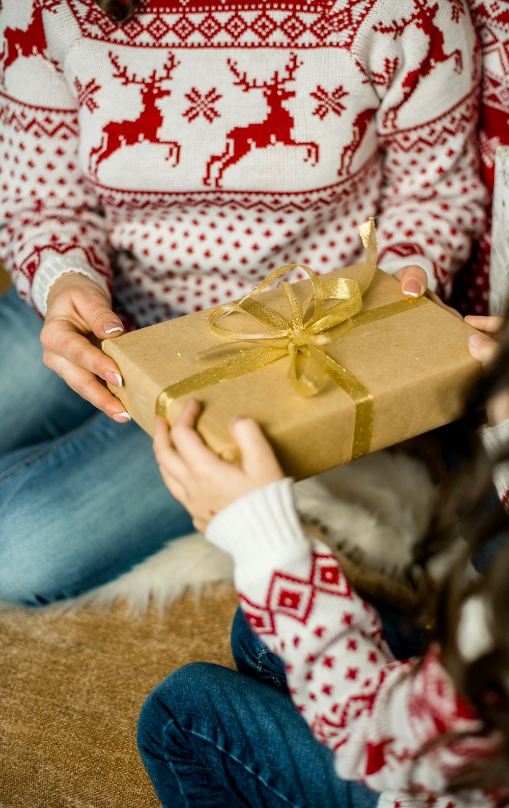 person holding brown gift box