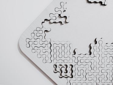 A flexible puzzle piece fitting perfectly into a complex digital network.