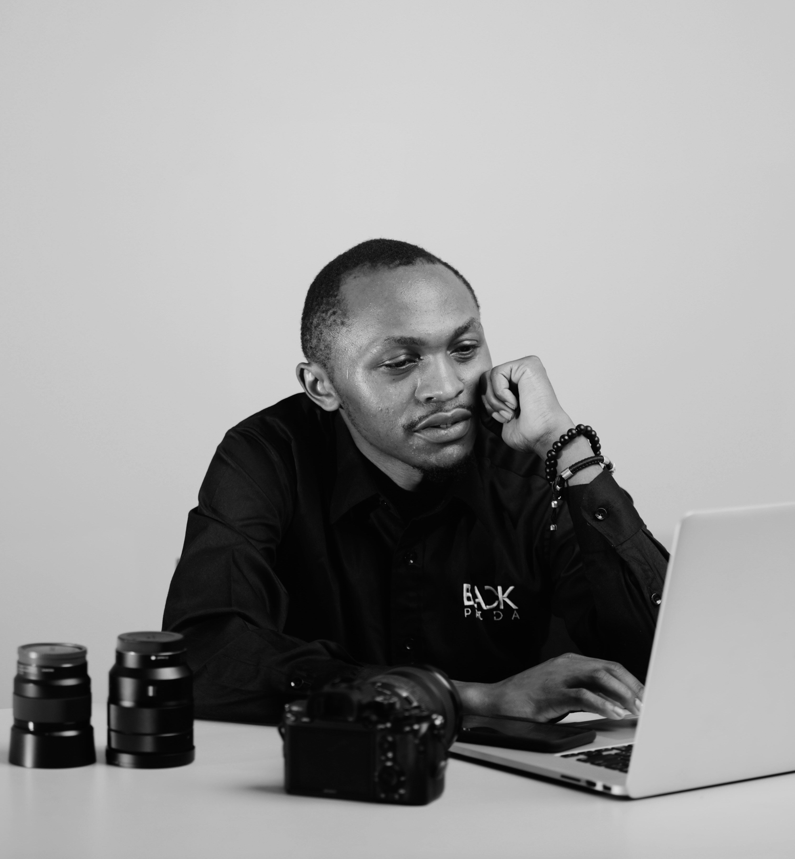 a man sitting in front of a laptop computer
