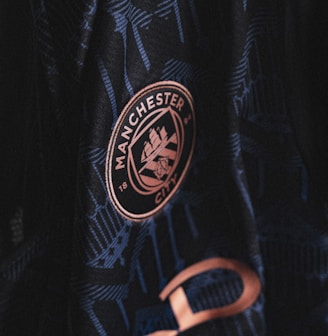 a close up of a man's jacket with a badge on it