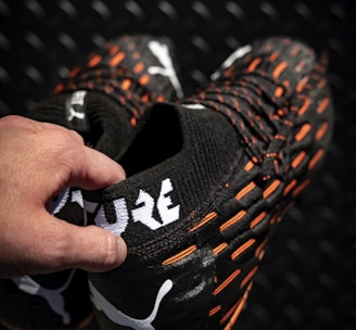 black and orange nike athletic shoes
