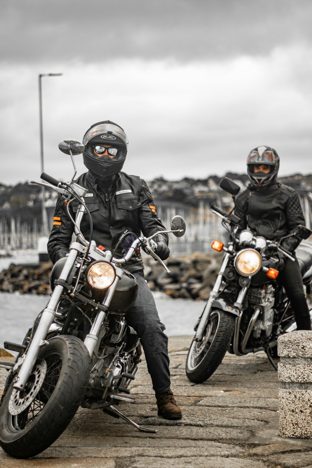 man in black helmet riding black motorcycle