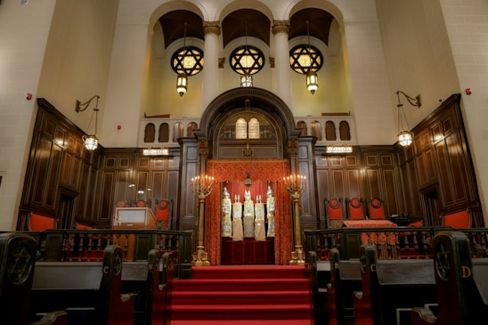 brown wooden chairs inside church