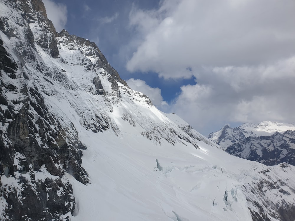 snow covered mountain under blue sky during daytime