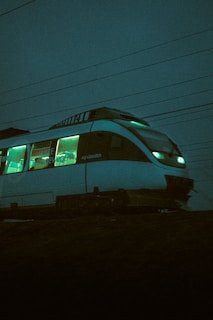 white and blue train during night time