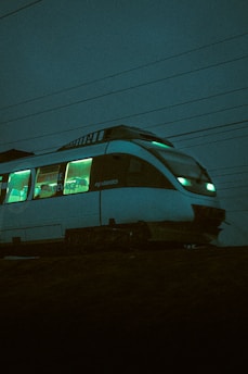 white and blue train during night time