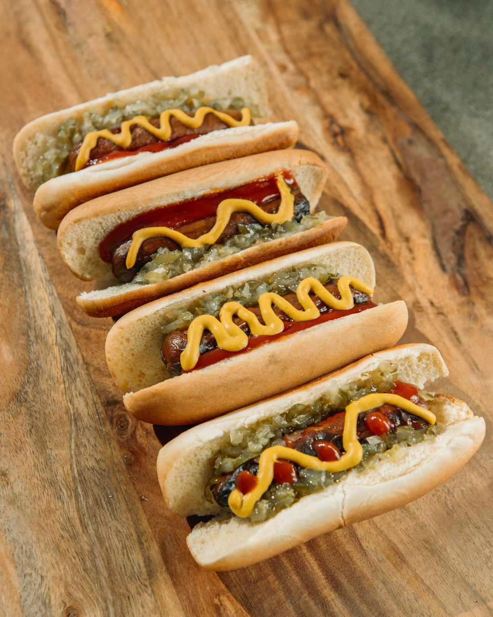 hotdog sandwich on brown wooden table