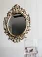 gold floral frame on white textile