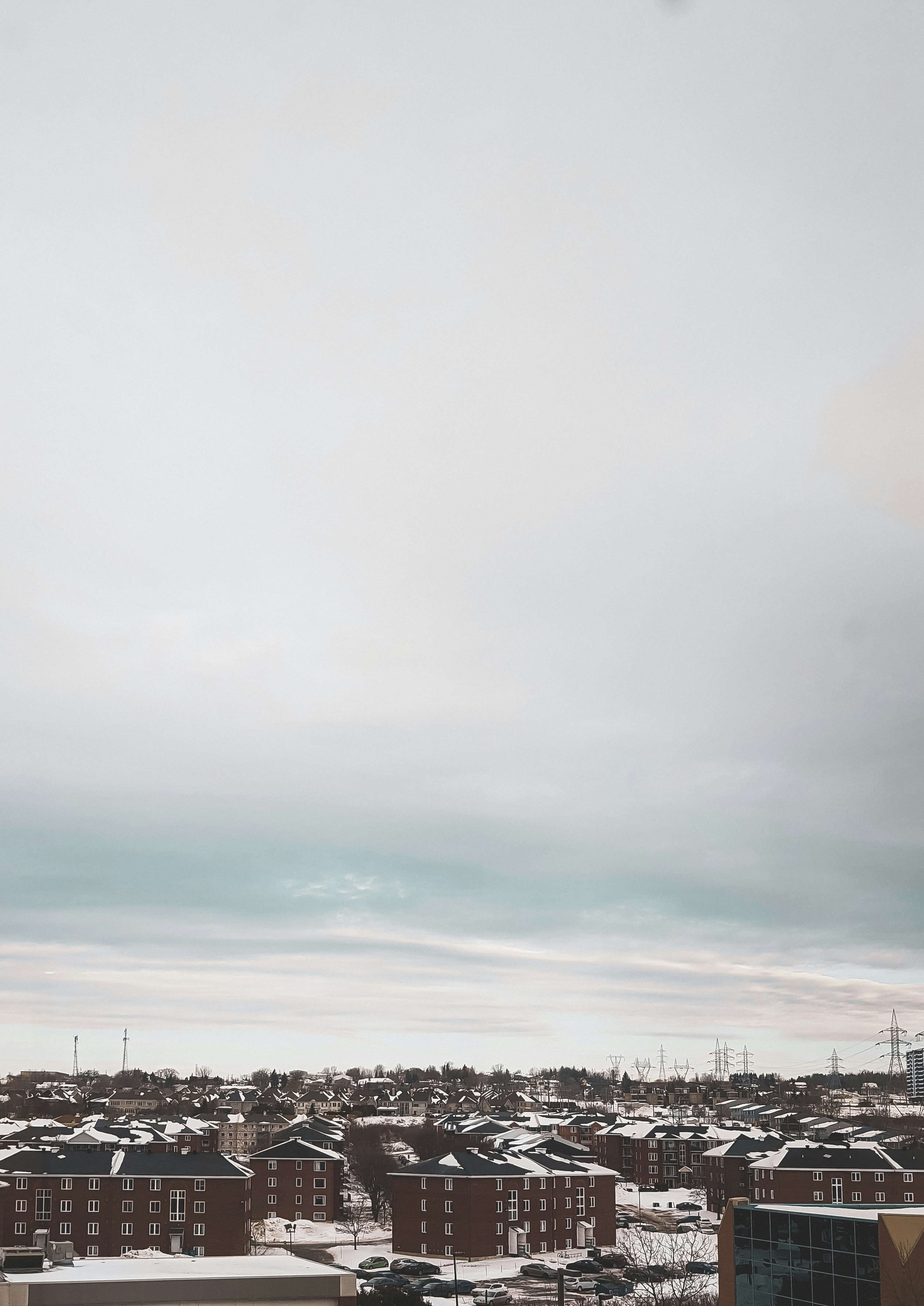 white clouds over city during daytime
