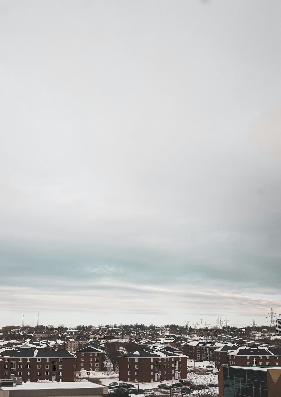 white clouds over city during daytime