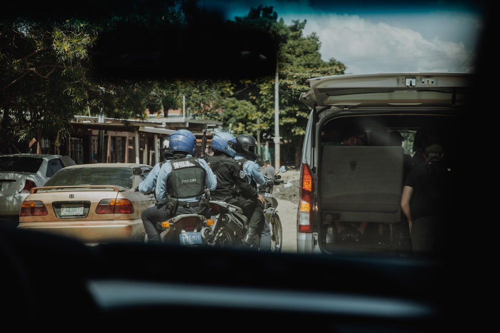 man in black helmet riding motorcycle during daytime