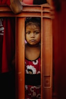 boy in red and black crew neck shirt