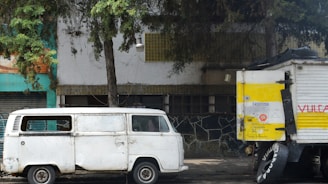 A modest plumbing van parked outside a small-town home in Jasper, Texas.