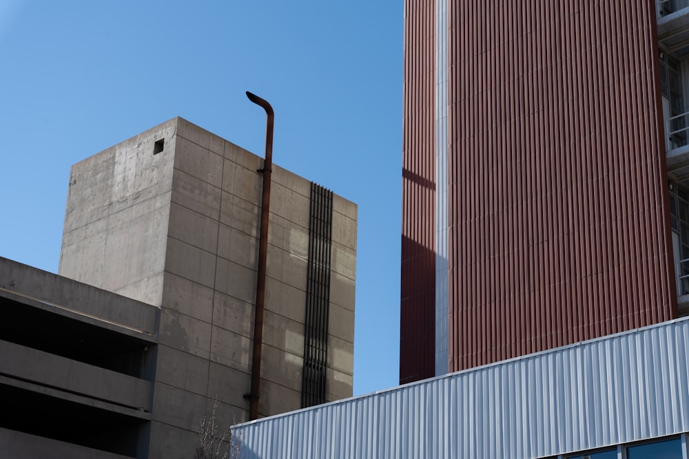 brown and white concrete building under blue sky during daytime