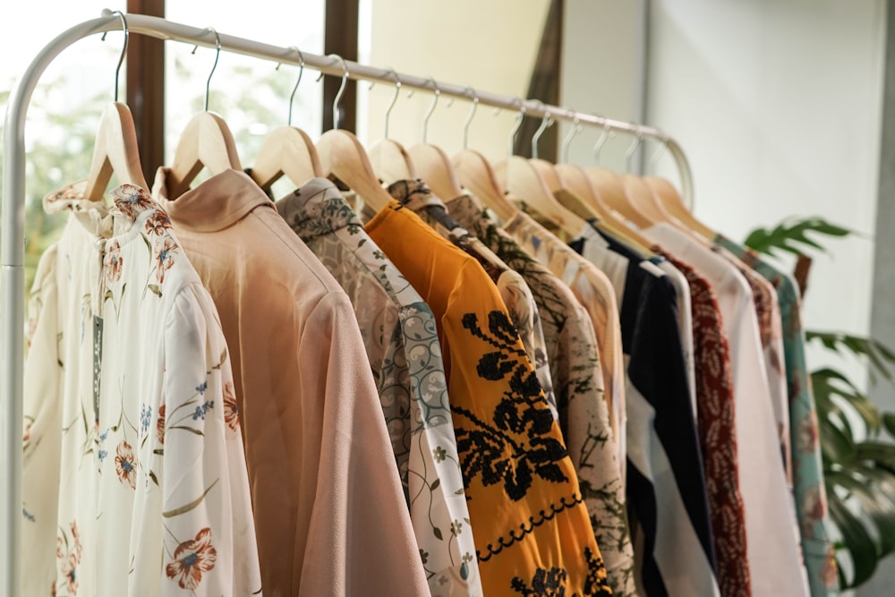 White T Shirt for Kids on Hangers in Clothing Store. Stock Image