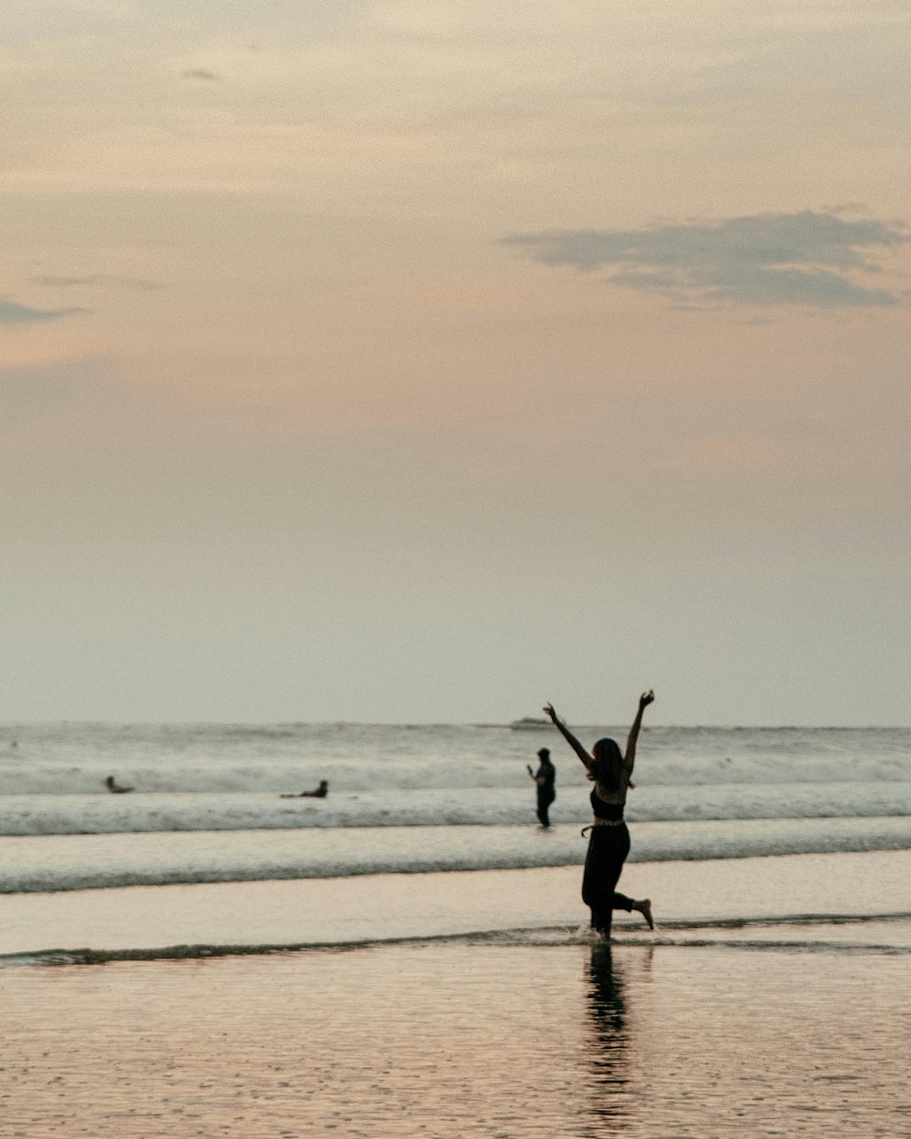 2 person walking on beach during daytime