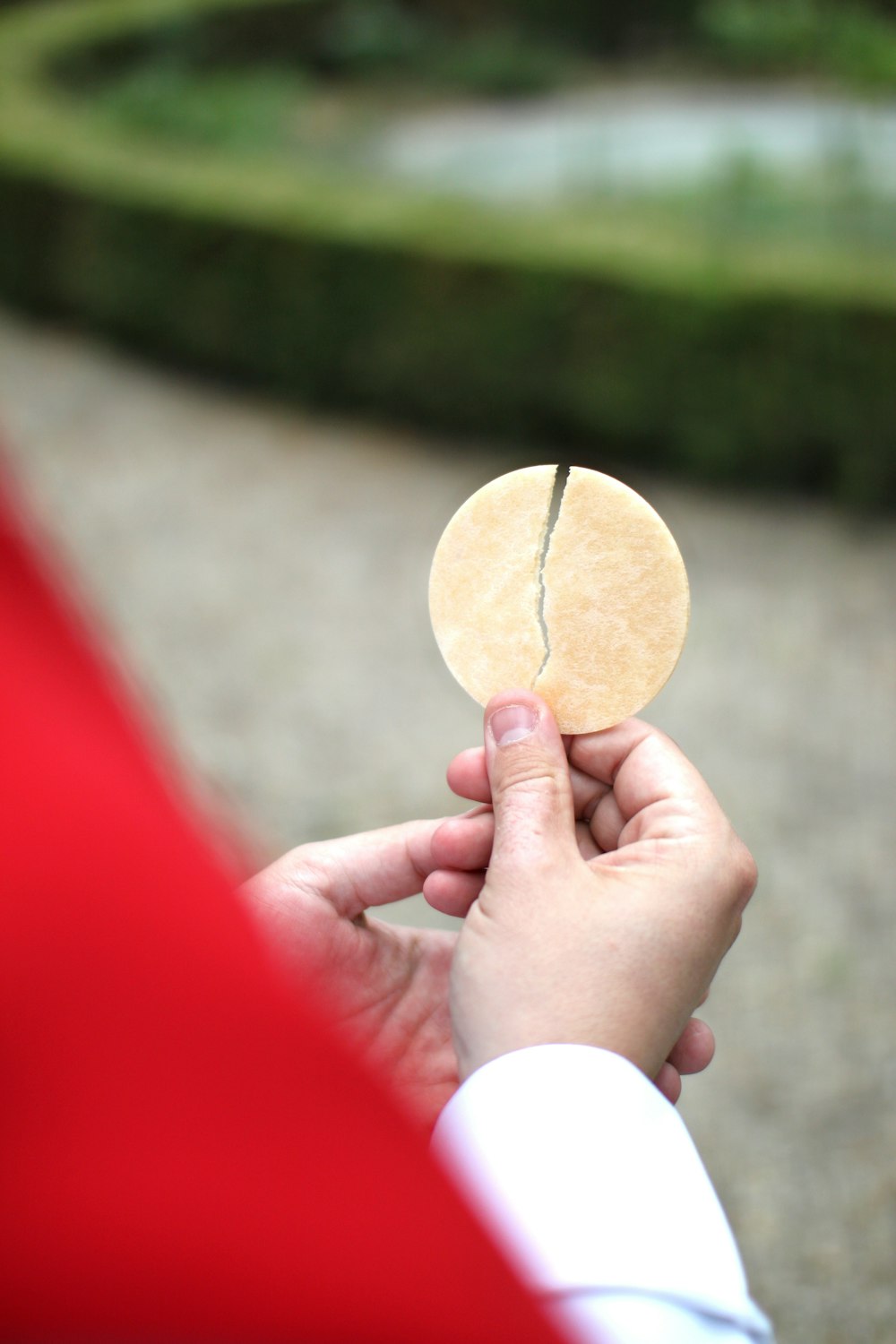 person holding brown round ornament