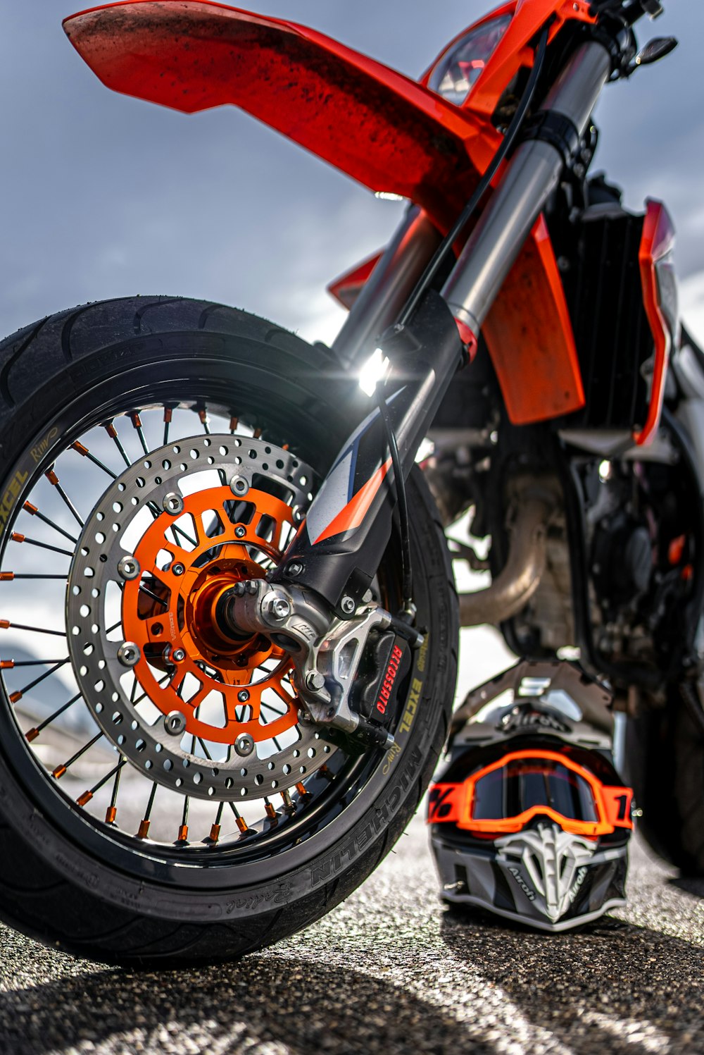 black and orange motorcycle in close up photography