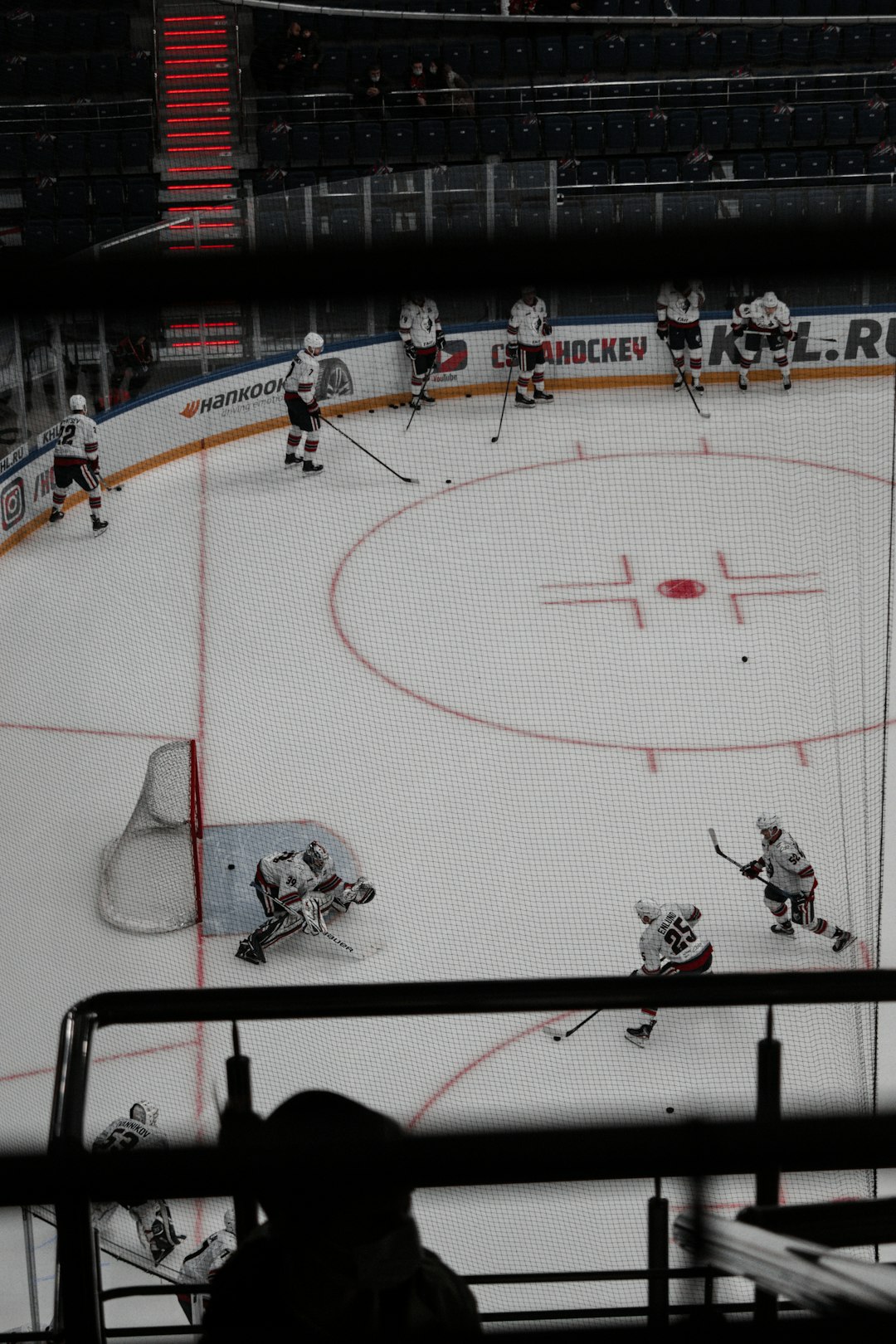 people playing ice hockey on stadium