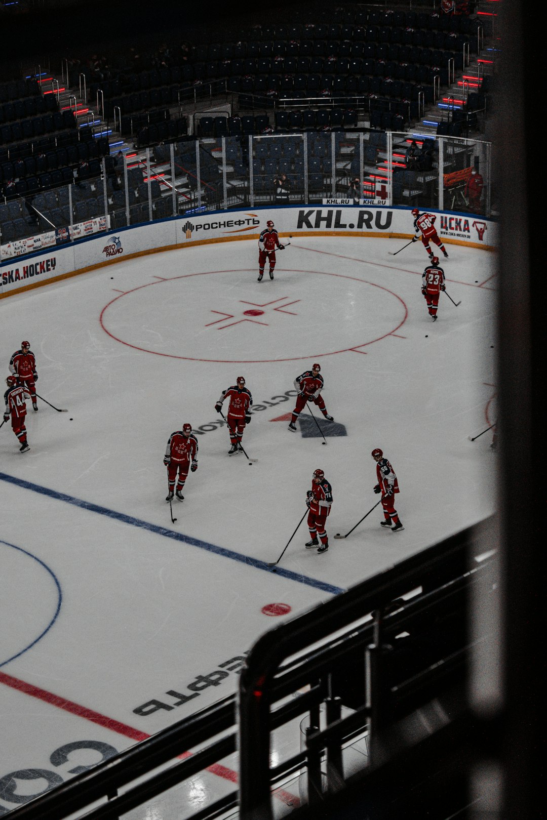 people playing ice hockey on ice stadium