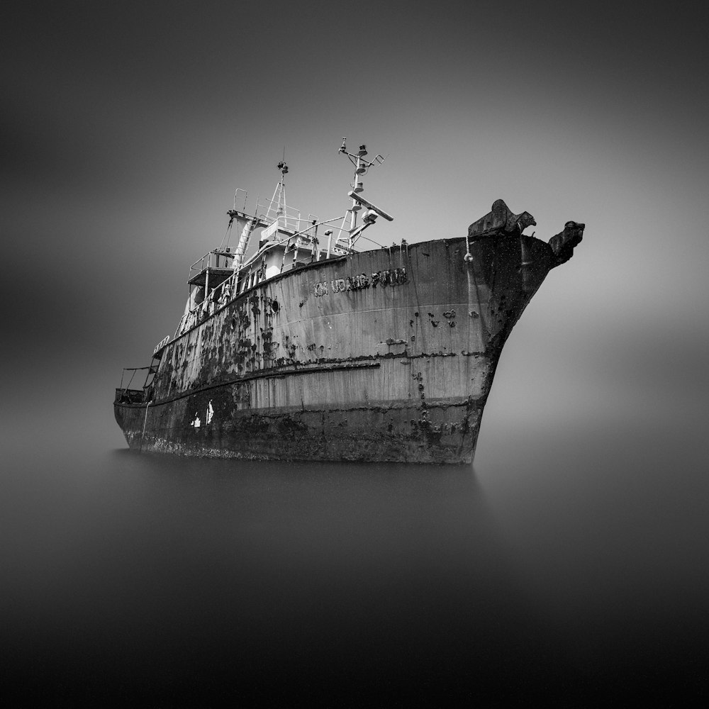 grayscale photo of ship on sea