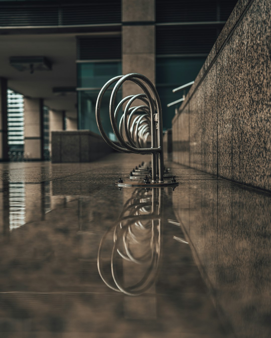 stainless steel spiral staircase in grayscale photography