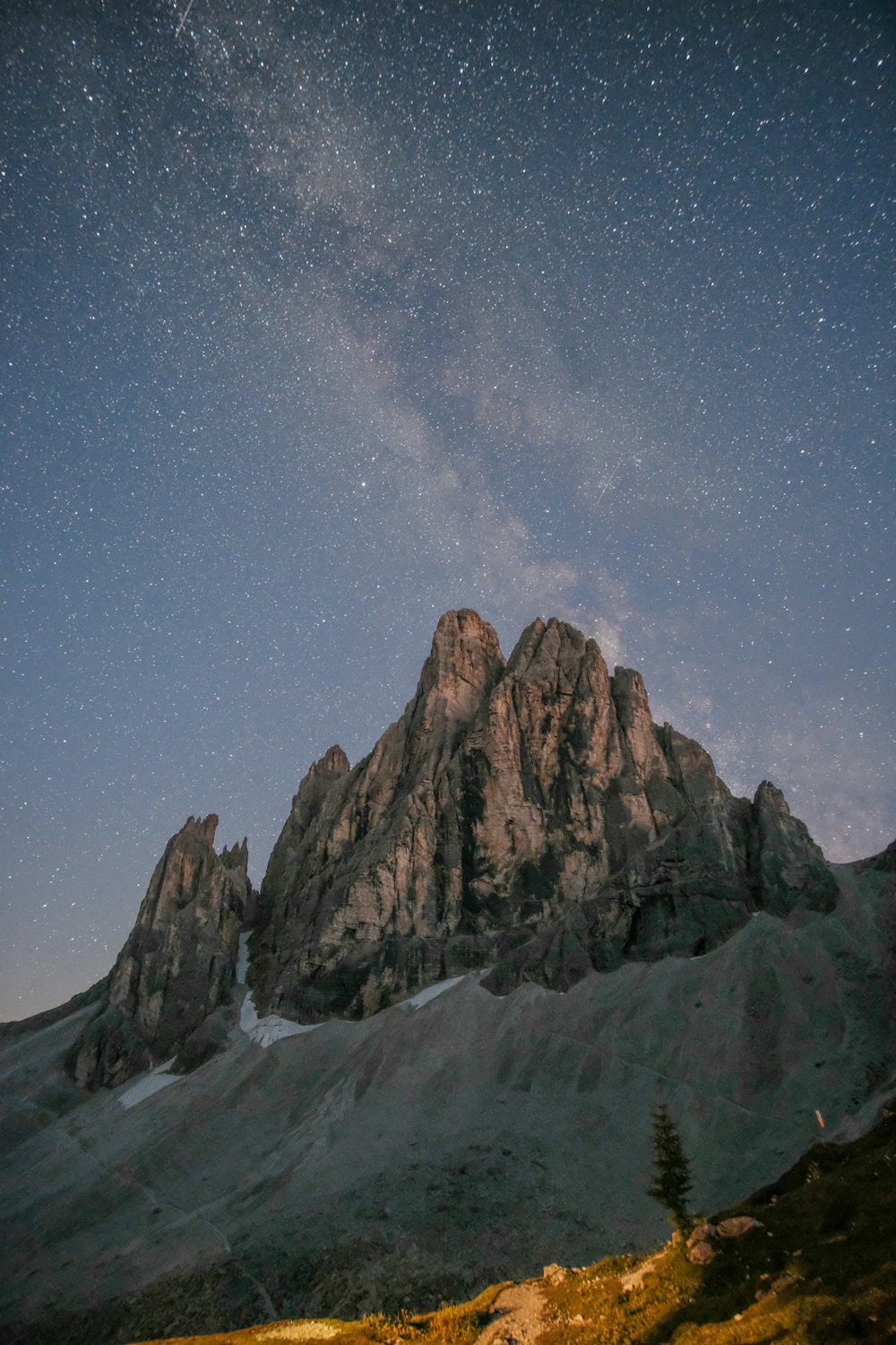 brown rocky mountain under blue sky during night time