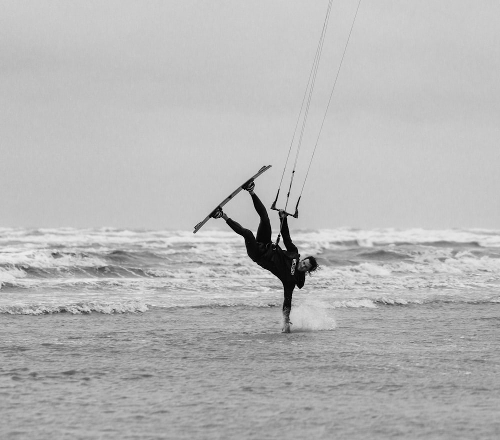 a person is doing a handstand in the water