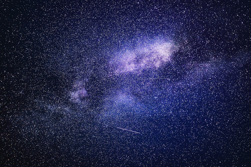 blue and black starry night sky