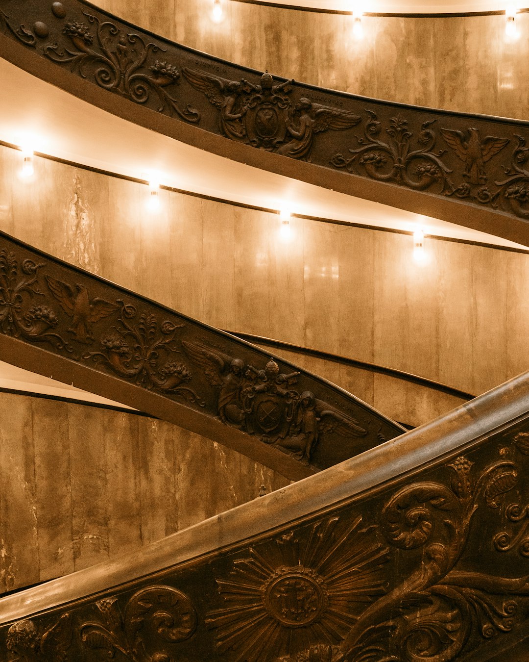 brown wooden spiral staircase with stainless steel railings