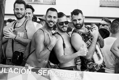 grayscale photo of 3 men and 2 women