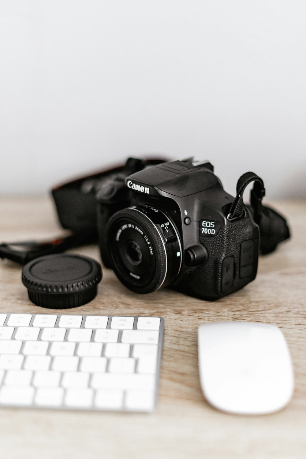 black nikon dslr camera on brown wooden table